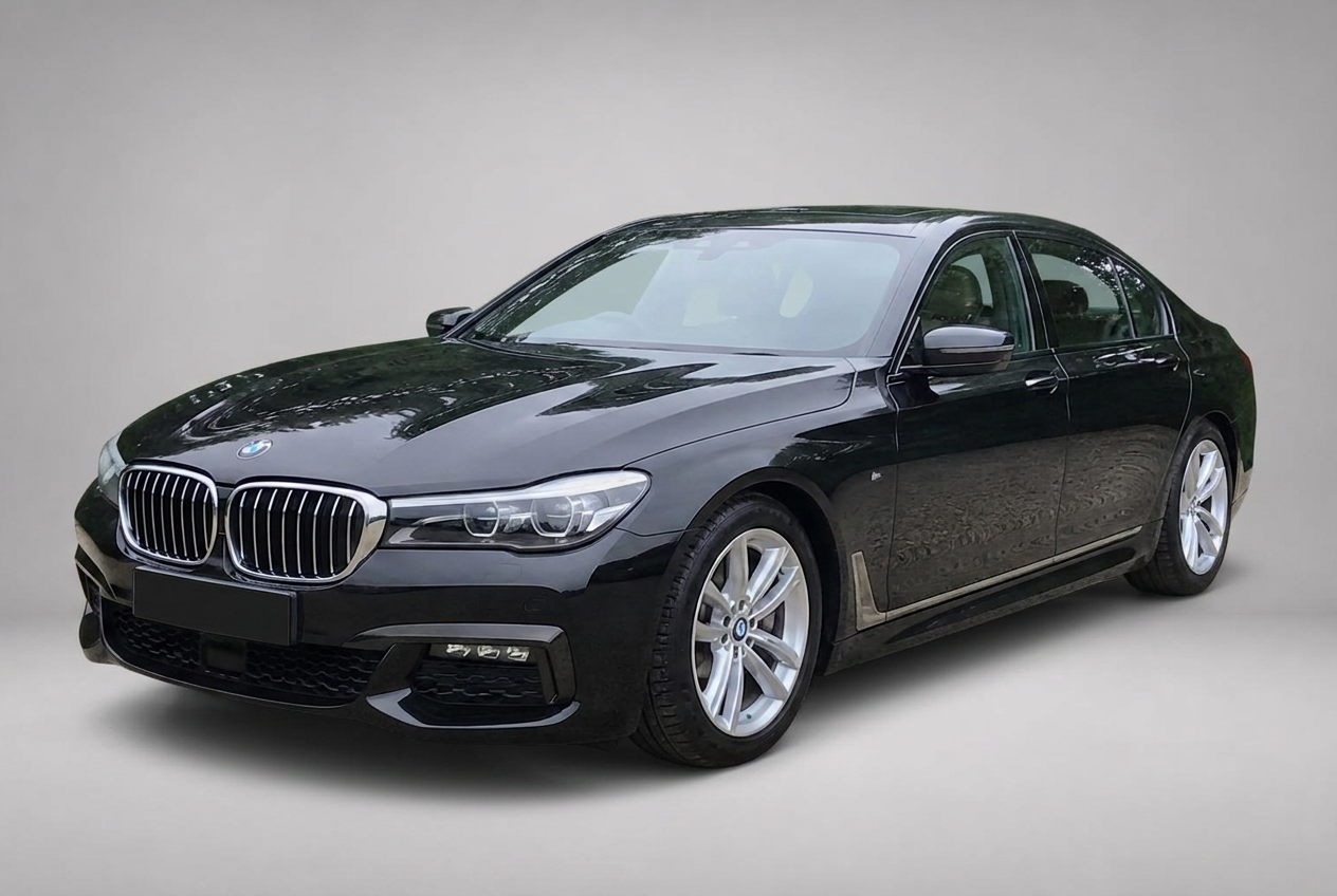 The same black BMW 7 Series placed inside a clean grey studio