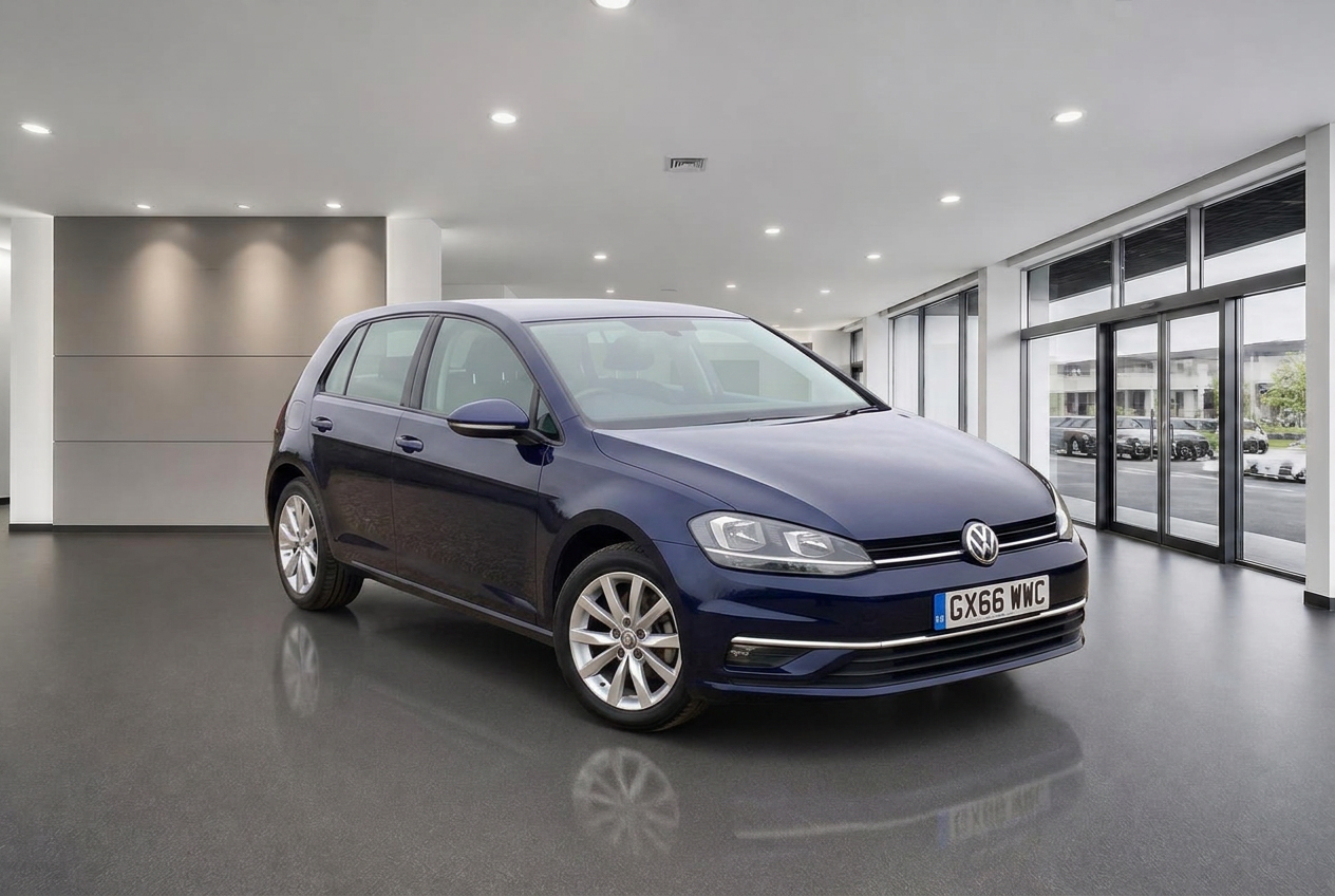 The same dark blue Volkswagen Golf in a bright modern grey dealership showroom