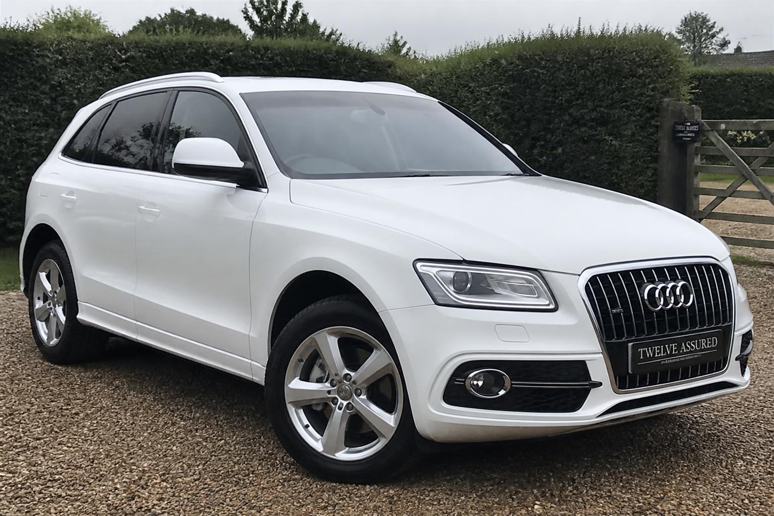 White Audi Q5 photographed on a gravel forecourt
