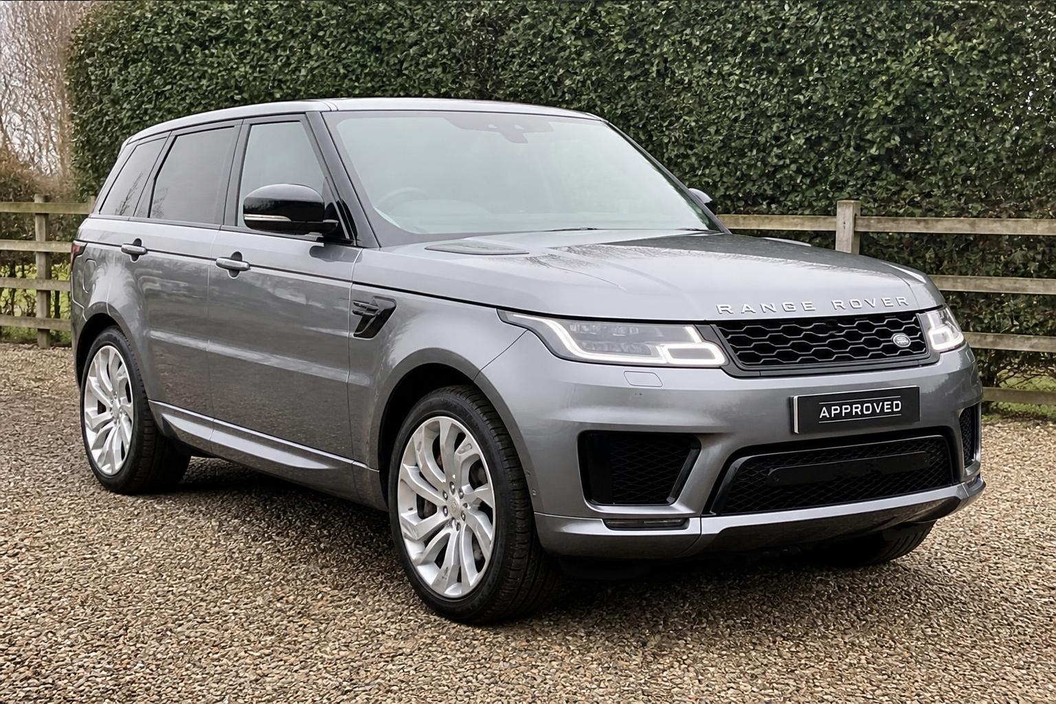 Silver Range Rover Sport photographed on a gravel forecourt